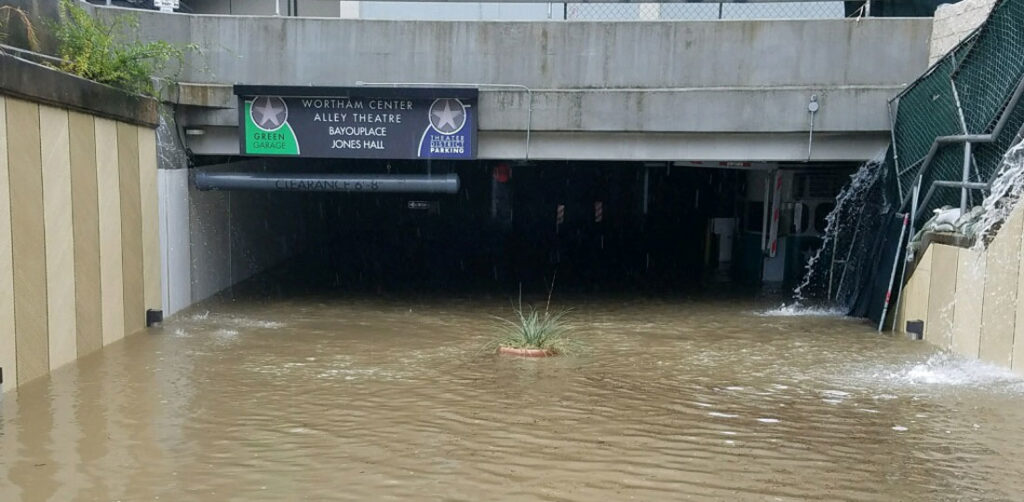 A heavily flooded underground parking facility in Houston's theater district.