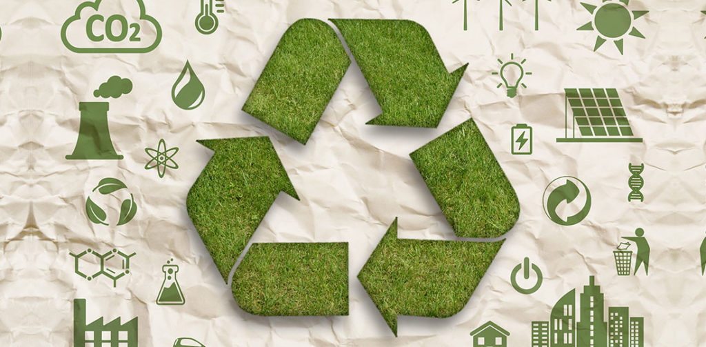 A recycling symbol made of grass on a brown paper background. Illustration.